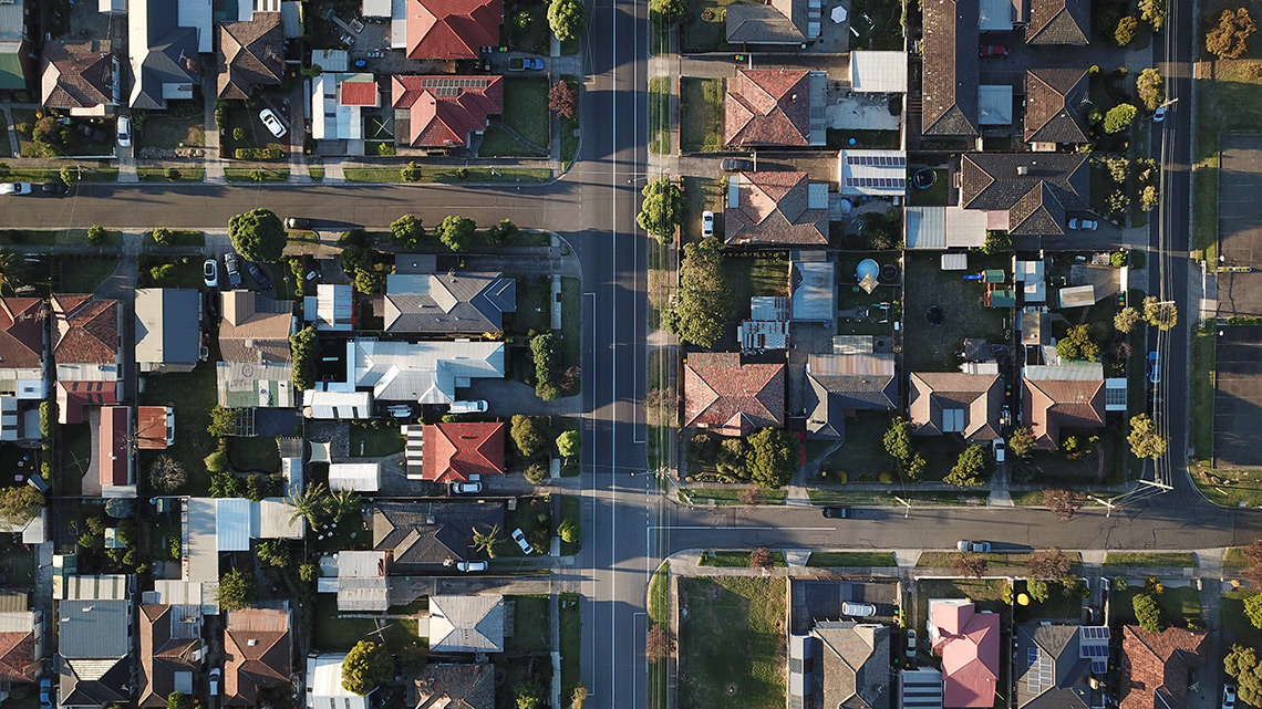 Aerial view of houses and streets of a suburb